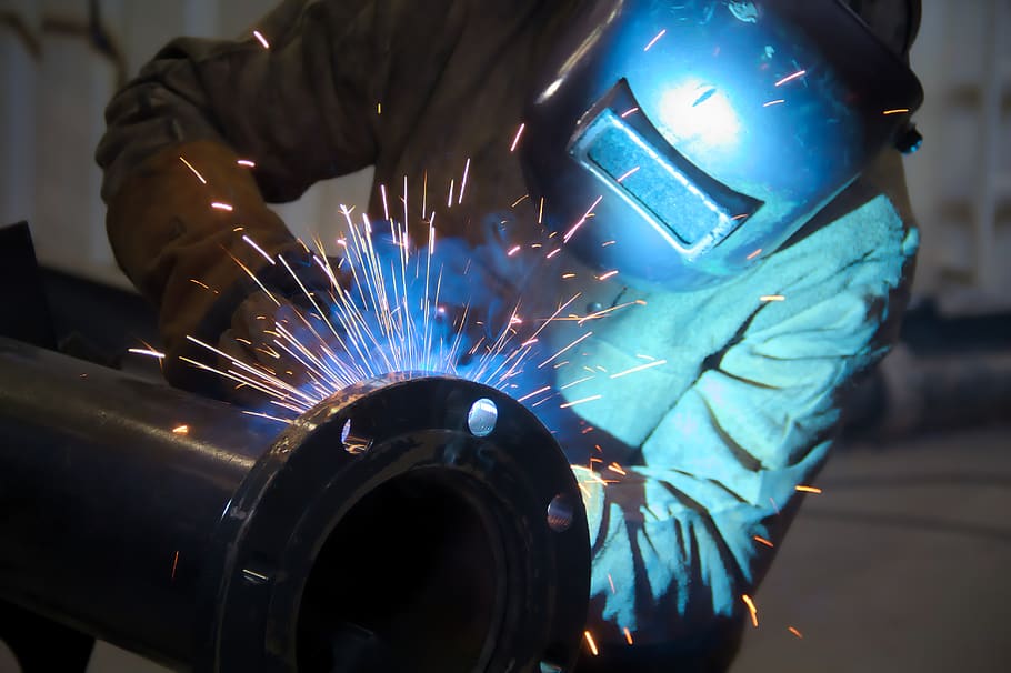 man-worker-work-sparks-metallurgical-welding